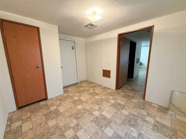 a view of backyard with a small cabin