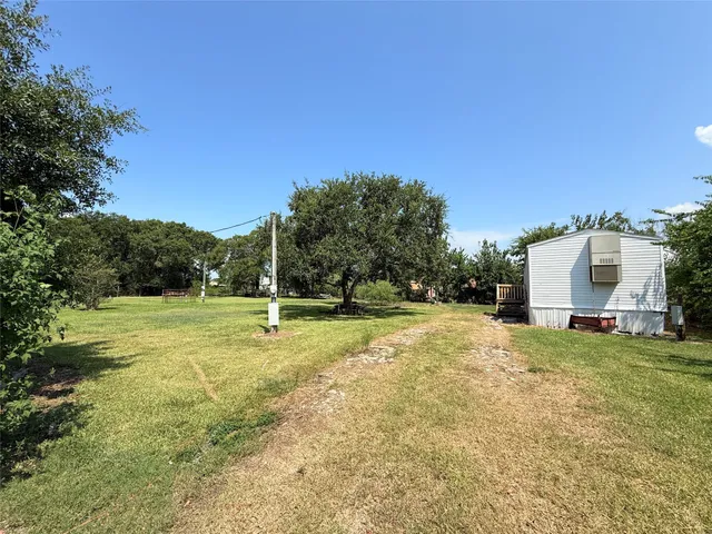 a view of a playground with basketball court