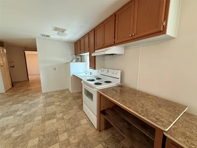a kitchen with a stove and a cabinet