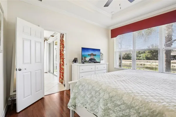 a large bedroom with a large bed and a window