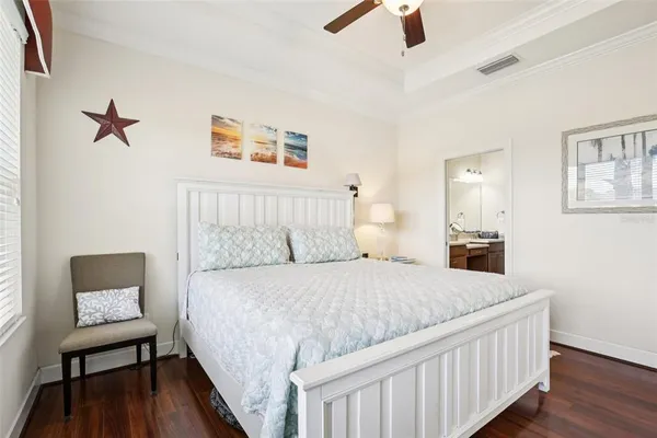 a bedroom with a bed and a chair