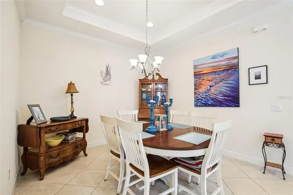 a dining room with furniture and window