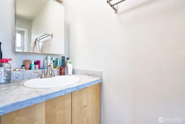 a bathroom with a sink and a mirror
