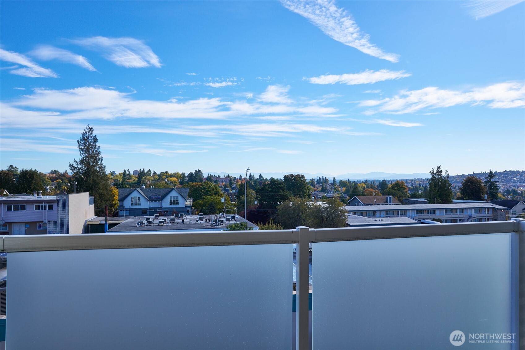 812 North 42nd Street, Unit 301 Seattle, WA 98103 - Photo 21 of 29 a view of a street with a building in the background