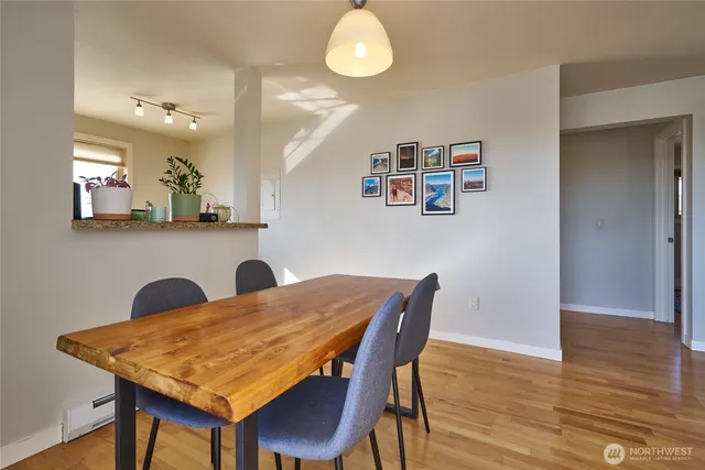 a view of a dining room with furniture and wooden floor
