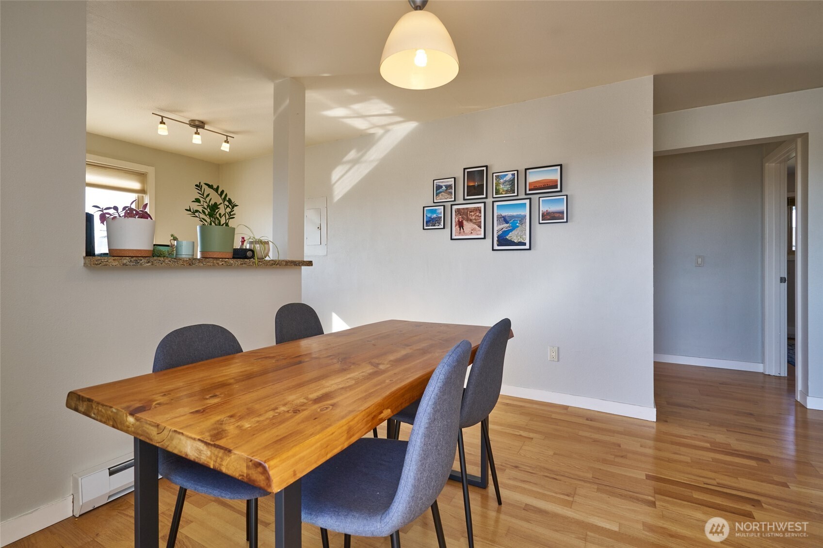 812 North 42nd Street, Unit 301 Seattle, WA 98103 - Photo 23 of 29 a view of a dining room with furniture and wooden floor