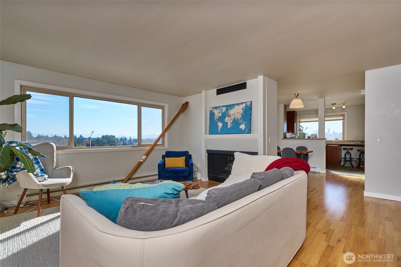 812 North 42nd Street, Unit 301 Seattle, WA 98103 - Photo 3 of 29 a living room with furniture and a floor to ceiling window