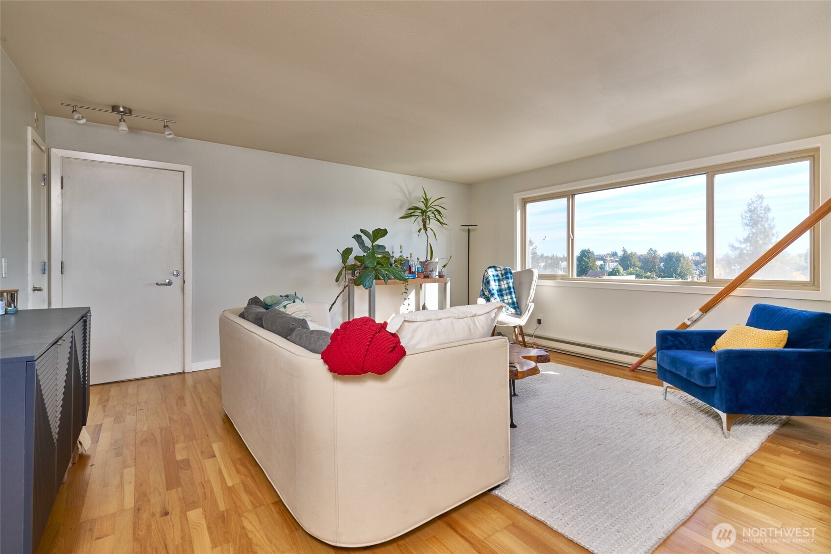 812 North 42nd Street, Unit 301 Seattle, WA 98103 - Photo 4 of 29 a living room with furniture and a large window