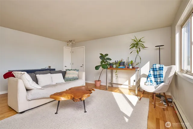 a living room with furniture and a table