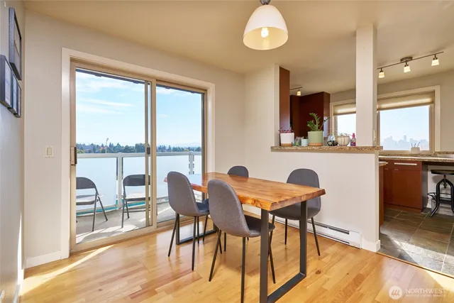 a view of a dining room with furniture and wooden floor