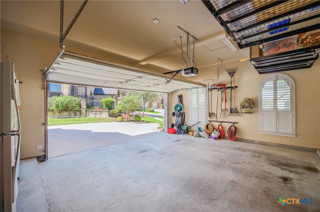 2427 Anderson Point Lane Spring, TX 77388 - Photo 36 of 46 2427 Anderson Point Ln, Spring, TX 77388 - Two car garage with door opener and overhead storage installed