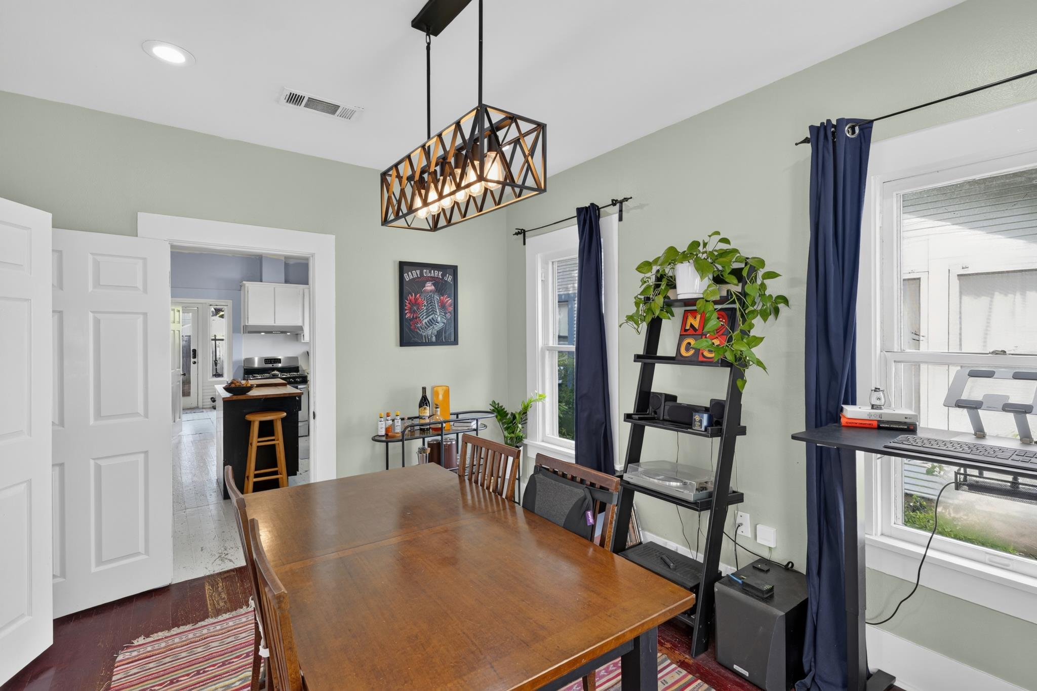 307 East 35th Street, Unit A Austin, TX 78705 - Photo 20 of 40 A refined dining space connects seamlessly with the kitchen, perfect for everyday meals and entertaining.