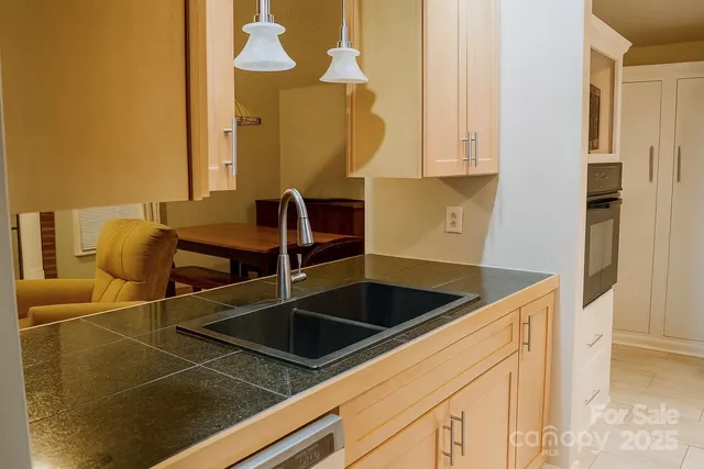 a kitchen with a sink and cabinets