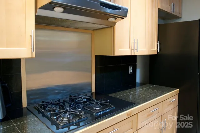a kitchen with a stove and a microwave