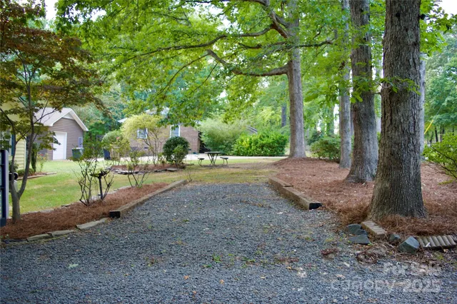 a view of a tree in front of a house