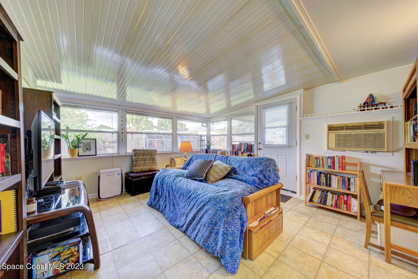 2180 Cindy Circle Melbourne, FL 32935 - Photo 12 of 31 a living room with furniture and a flat screen tv