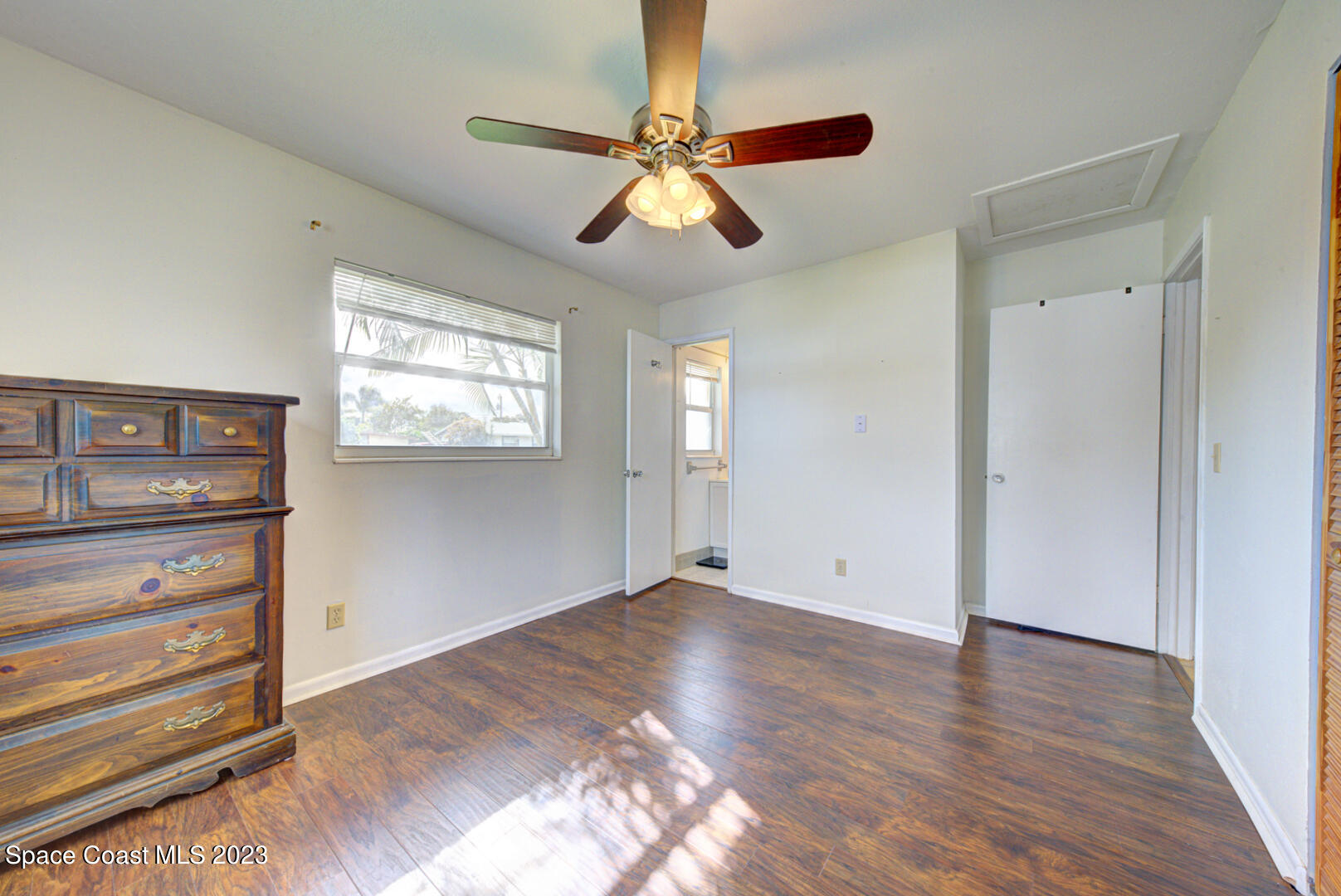 2180 Cindy Circle Melbourne, FL 32935 - Photo 15 of 31 a view of empty room with wooden floor and fan