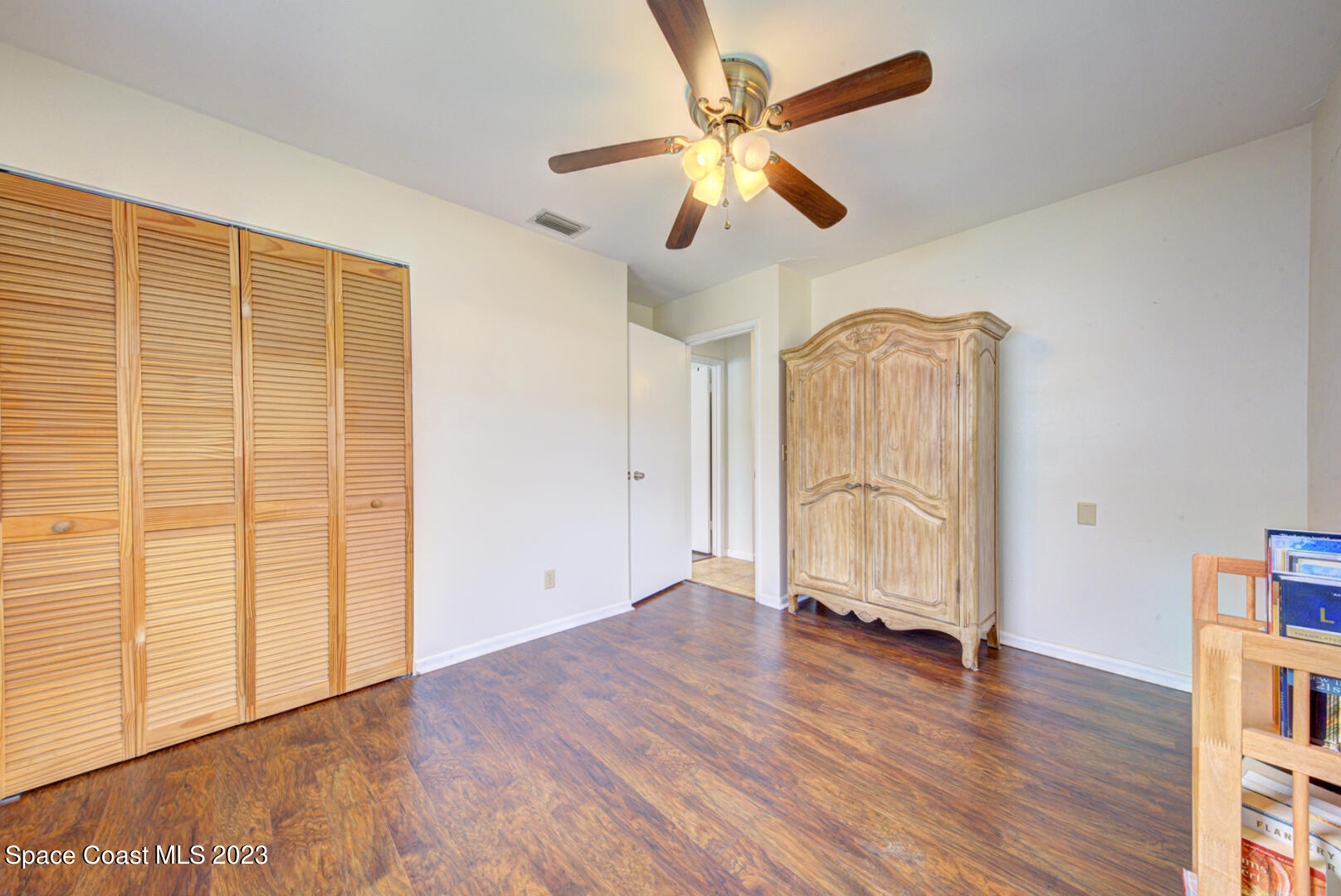 2180 Cindy Circle Melbourne, FL 32935 - Photo 20 of 31 wooden floor in an empty room with a window