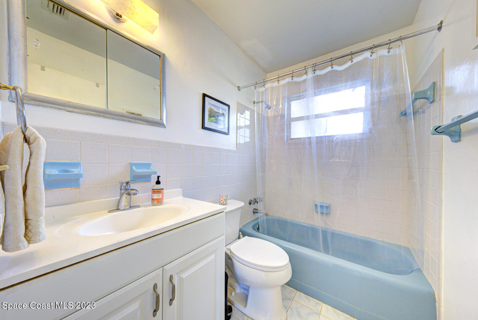 2180 Cindy Circle Melbourne, FL 32935 - Photo 23 of 31 a bathroom with a sink a toilet and shower