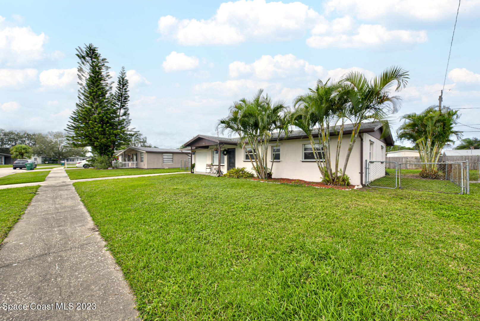 2180 Cindy Circle Melbourne, FL 32935 - Photo 31 of 31 a view of a house with a yard and sitting area