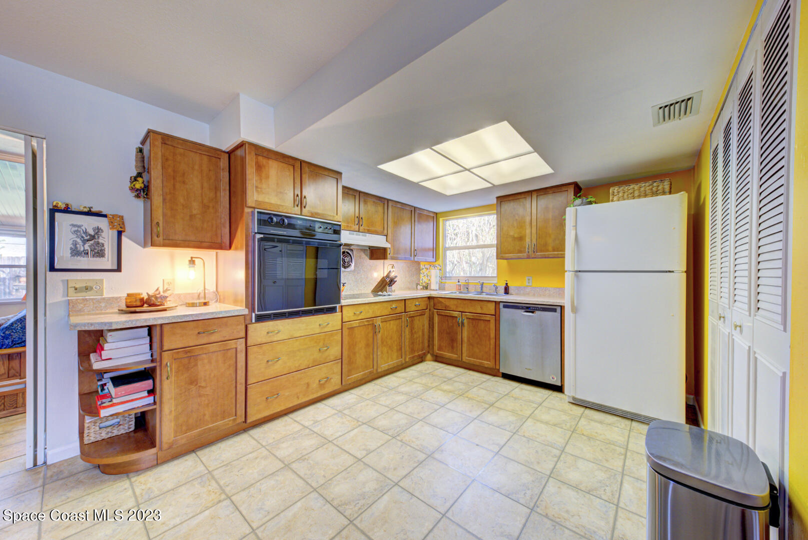 2180 Cindy Circle Melbourne, FL 32935 - Photo 10 of 31 a kitchen with stainless steel appliances granite countertop a refrigerator and a stove top oven