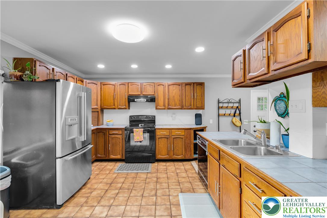 2242 Church Road Bethlehem, PA 18015 - Photo 17 of 74 a kitchen with stainless steel appliances granite countertop a refrigerator a sink a stove and dishwasher