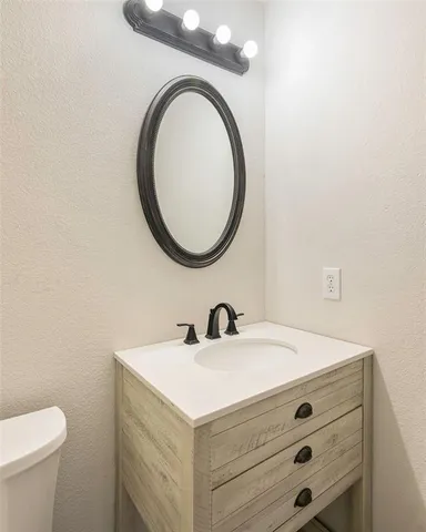 a bathroom with a sink and a toilet