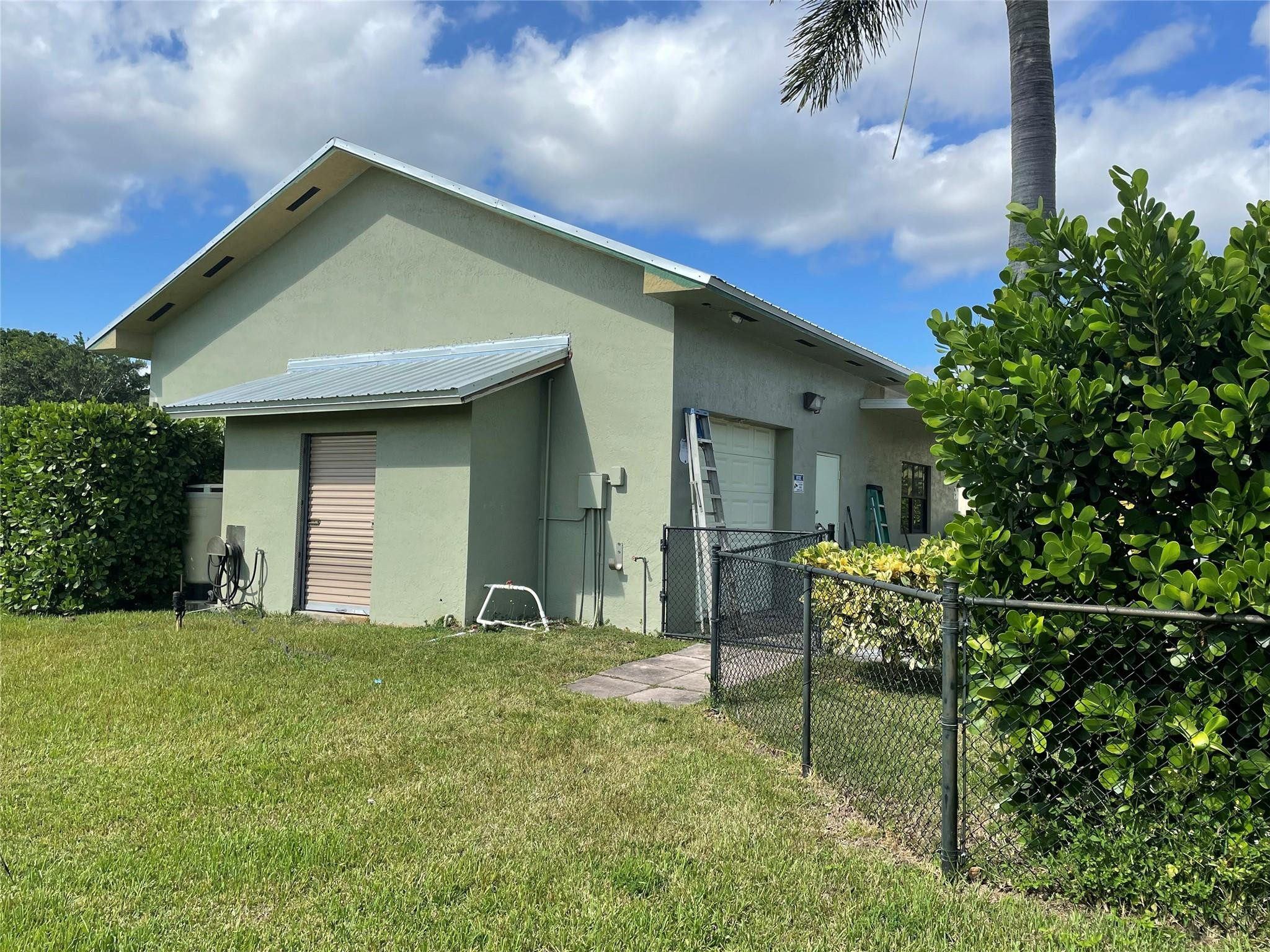 17001 Southwest 48th Street Southwest Ranches, FL 33331 - Photo 11 of 35 a front view of a house with yard
