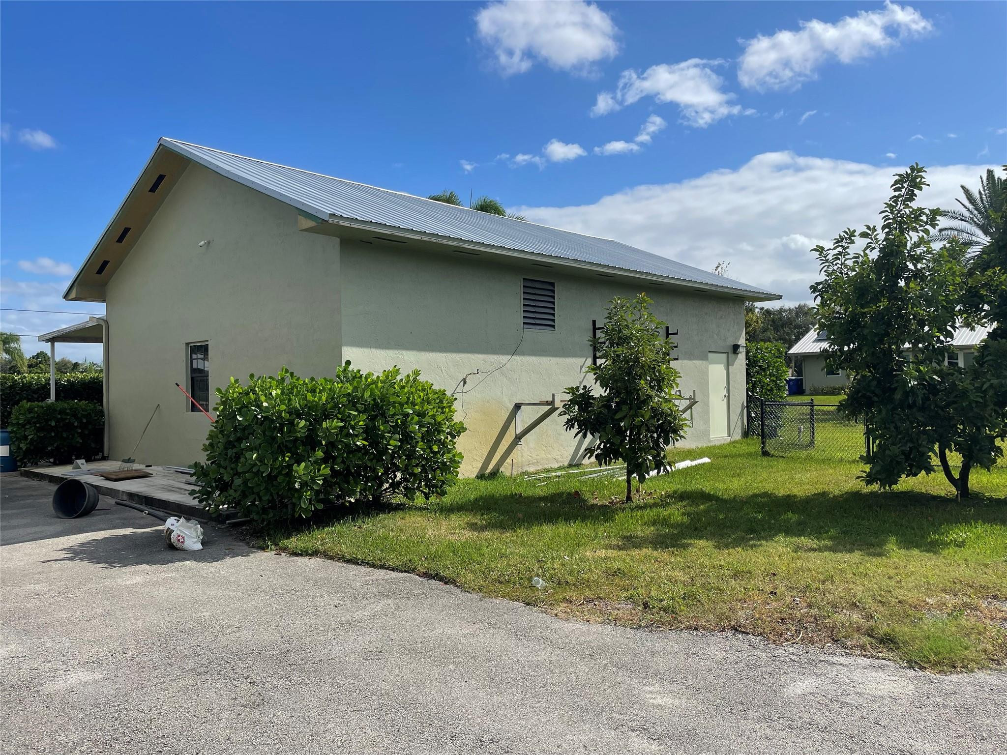 17001 Southwest 48th Street Southwest Ranches, FL 33331 - Photo 12 of 35 a house view with a garden space
