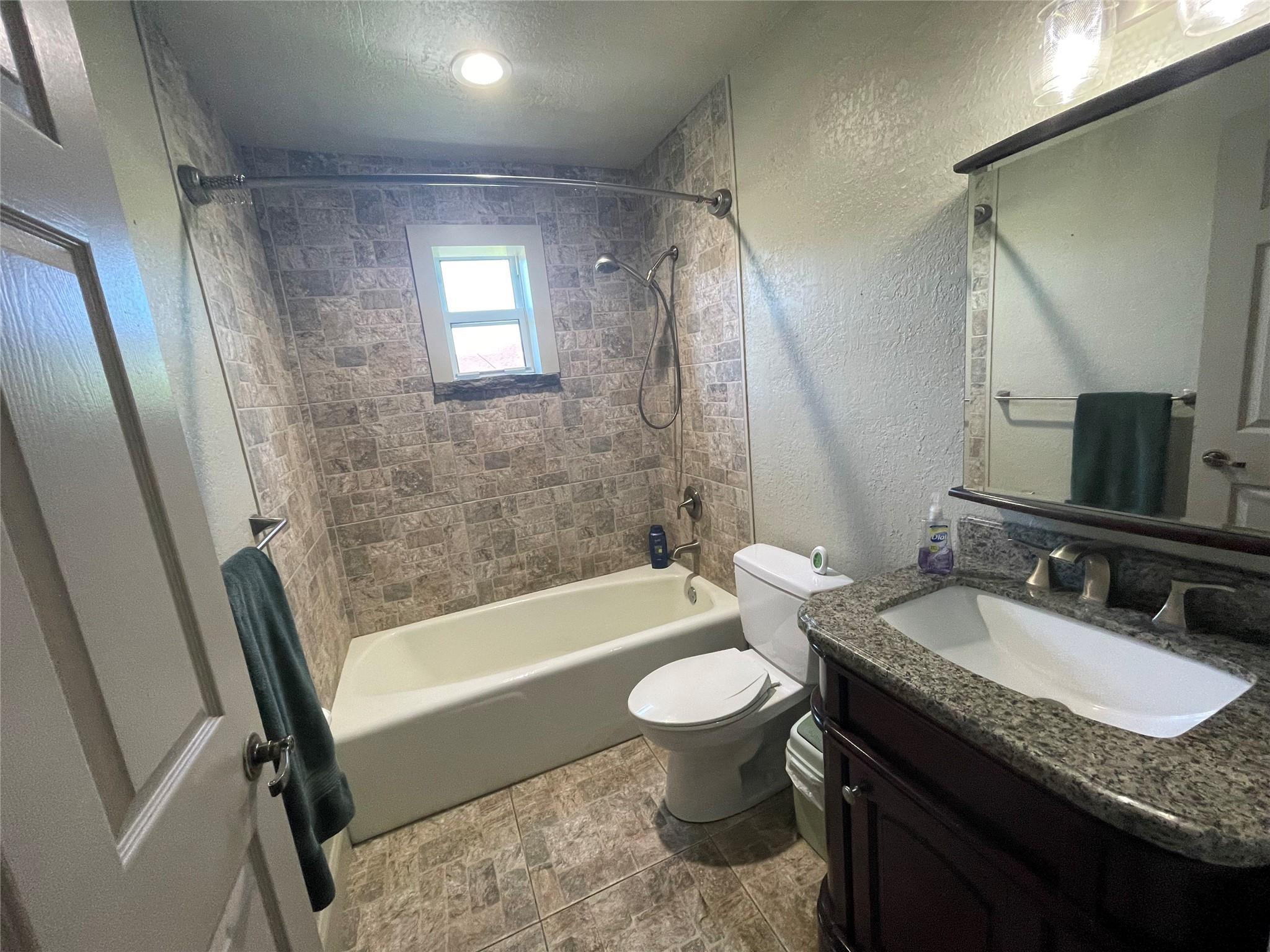 17001 Southwest 48th Street Southwest Ranches, FL 33331 - Photo 15 of 35 a bathroom with a granite countertop sink toilet and shower