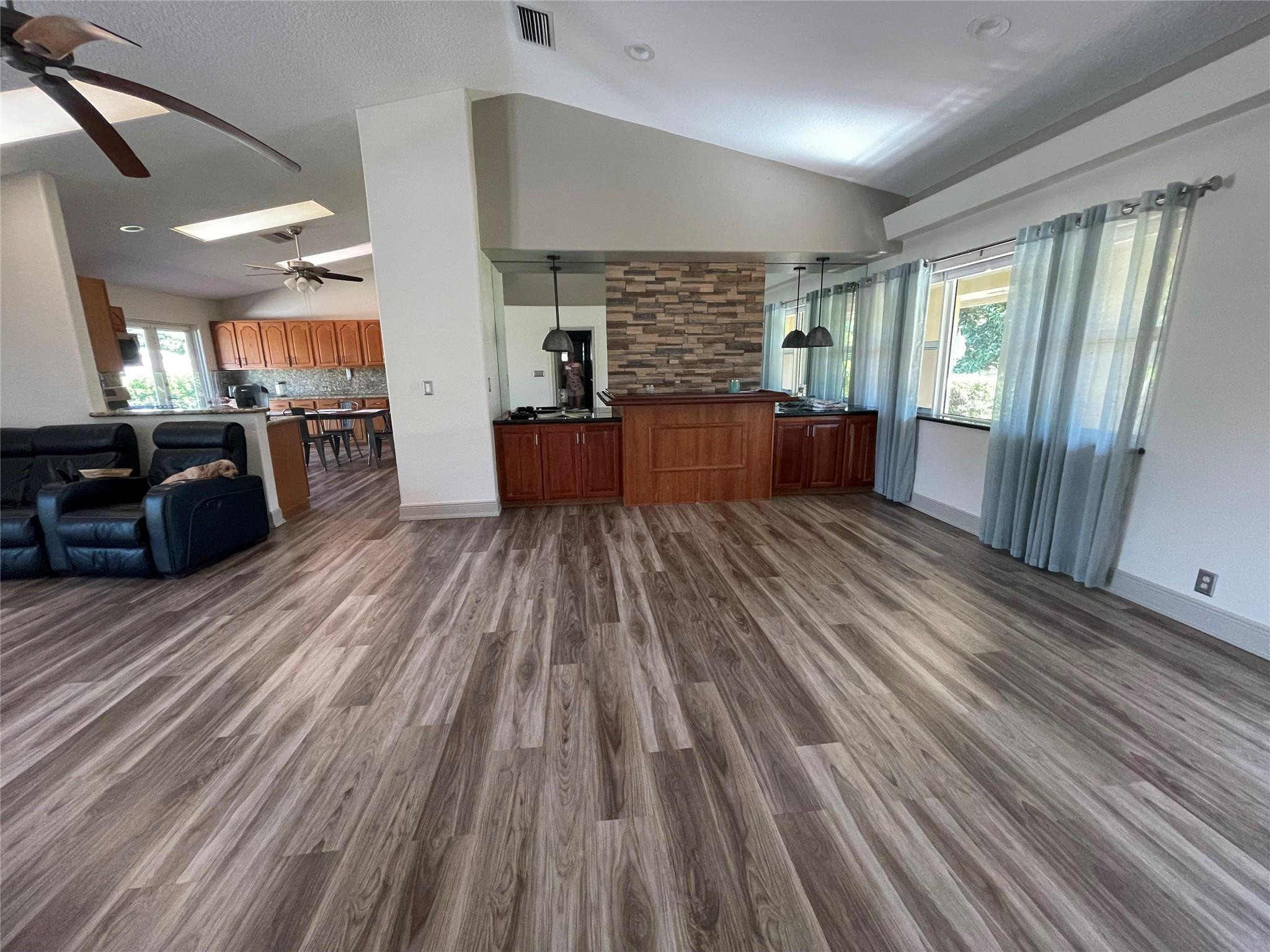 17001 Southwest 48th Street Southwest Ranches, FL 33331 - Photo 20 of 35 a large room with wooden floor and windows