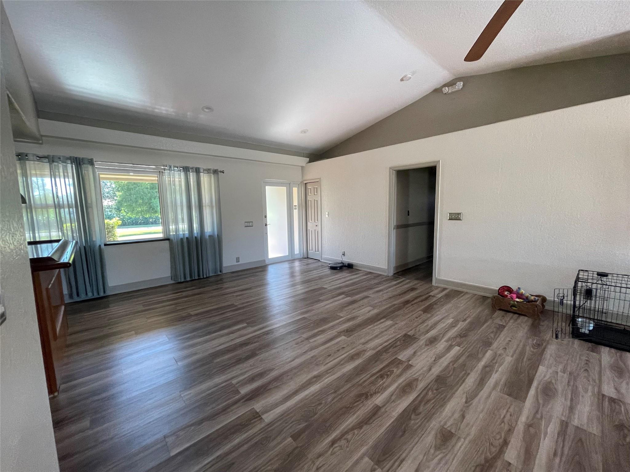 17001 Southwest 48th Street Southwest Ranches, FL 33331 - Photo 21 of 35 a view of empty room with wooden floor and fan