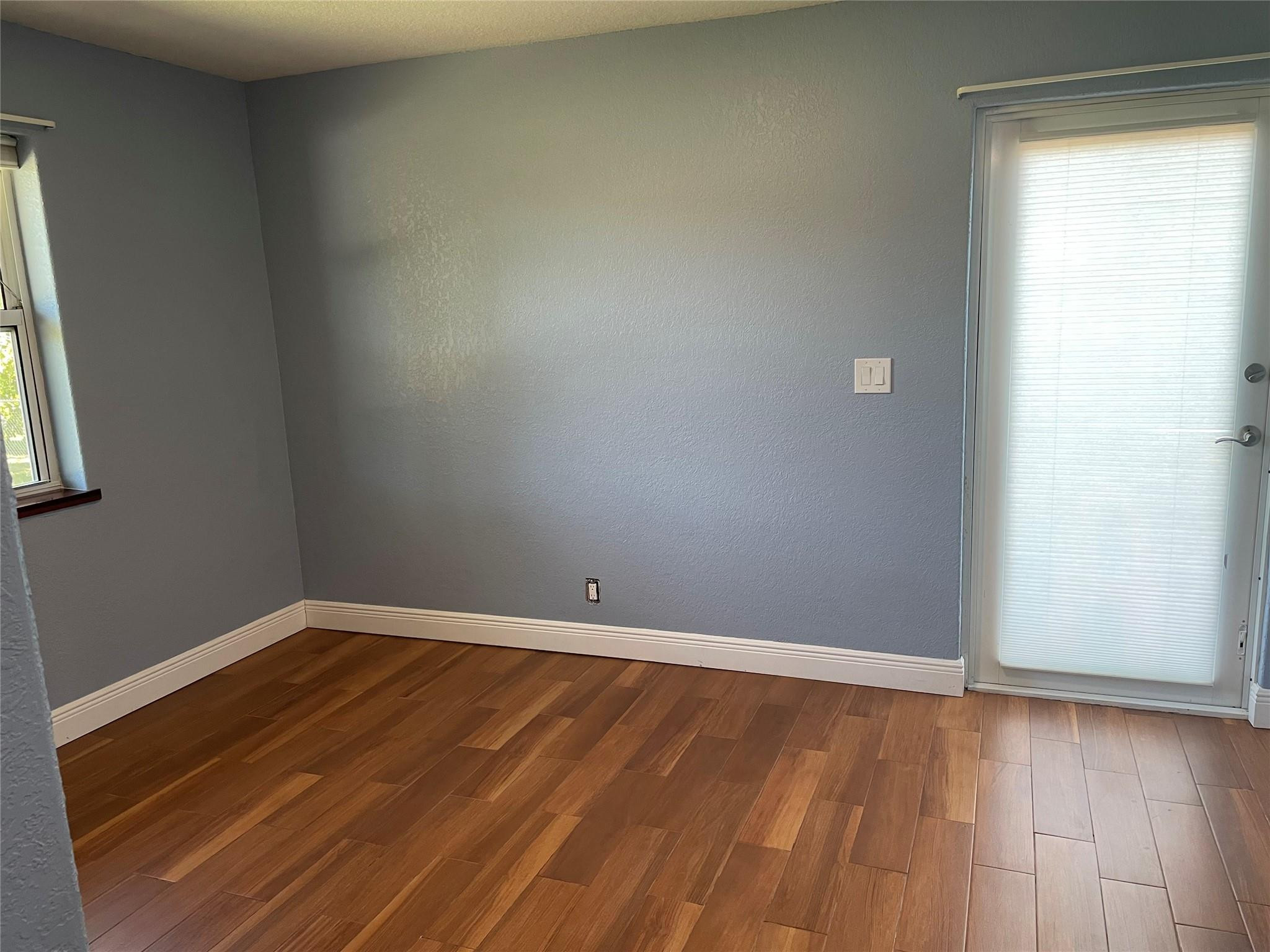 17001 Southwest 48th Street Southwest Ranches, FL 33331 - Photo 25 of 35 an empty room with wooden floor and windows