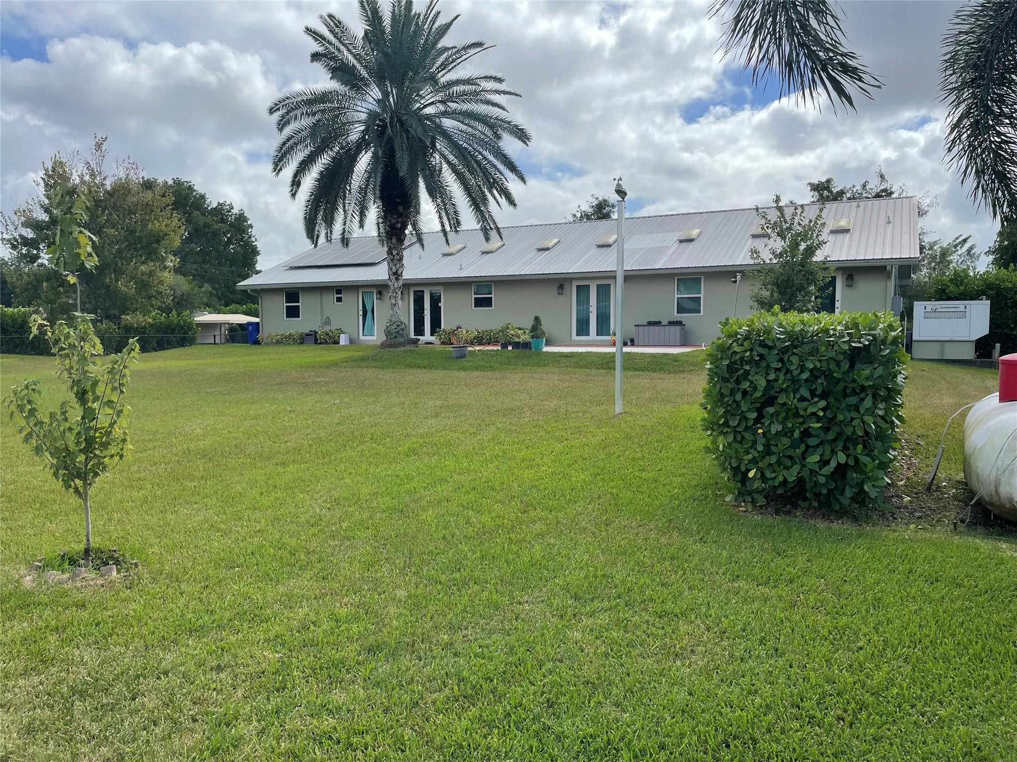 17001 Southwest 48th Street Southwest Ranches, FL 33331 - Photo 4 of 35 a view of a house with a garden