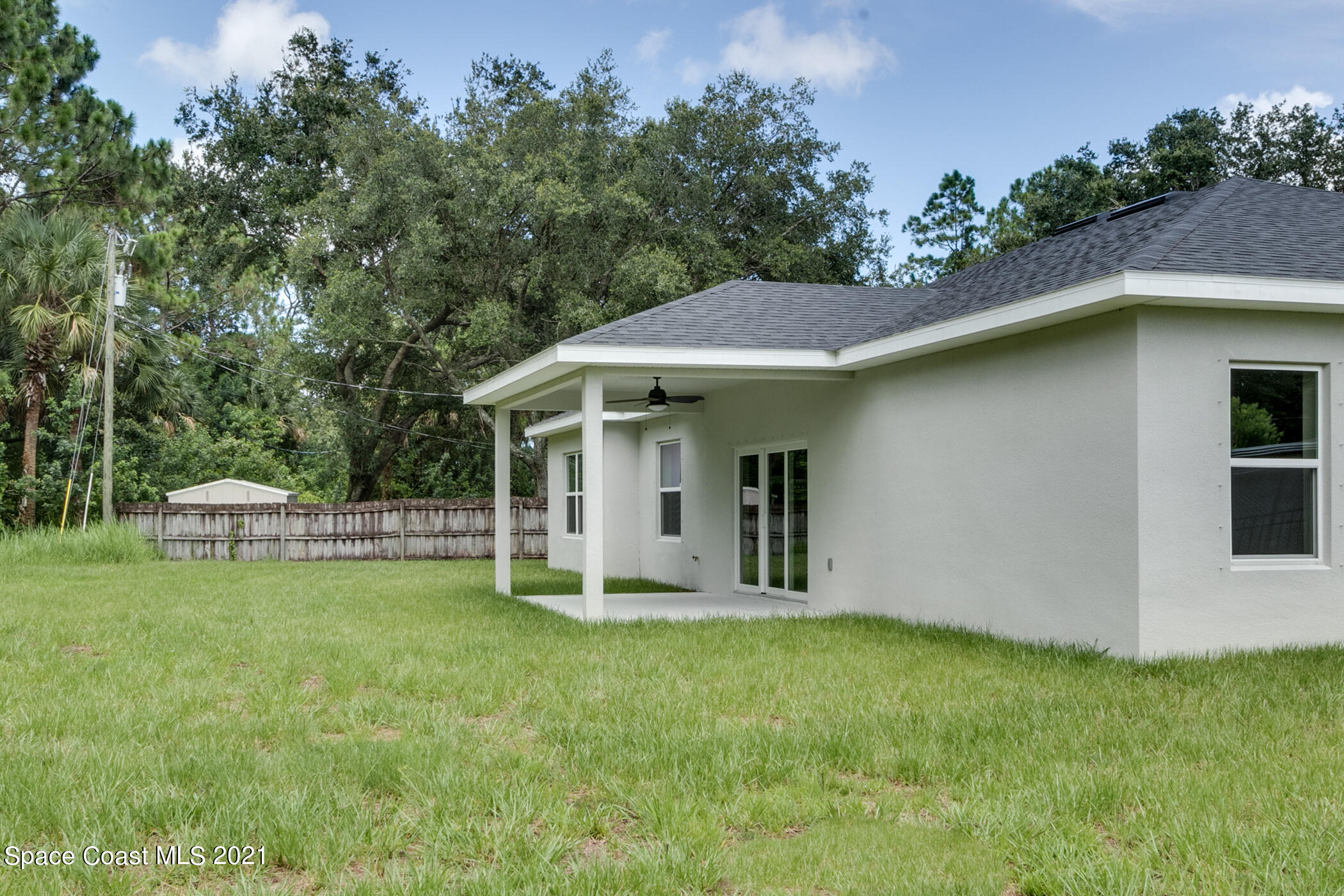 487 Abello Road Southeast, Unit 50 Palm Bay, FL 32909 - Photo 17 of 23 a front view of a house with a garden and plants