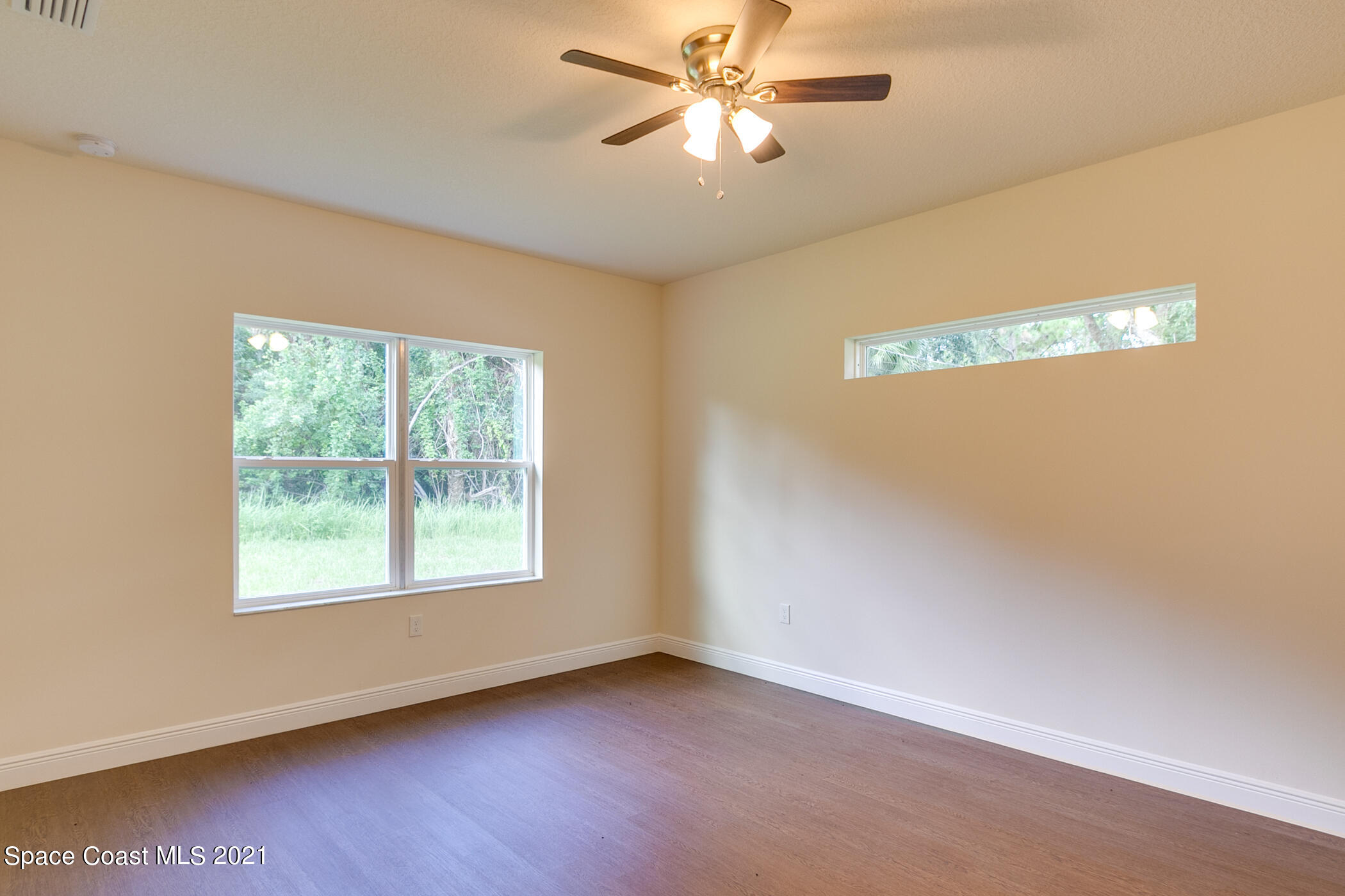 487 Abello Road Southeast, Unit 50 Palm Bay, FL 32909 - Photo 8 of 23 a view of an empty room with a window