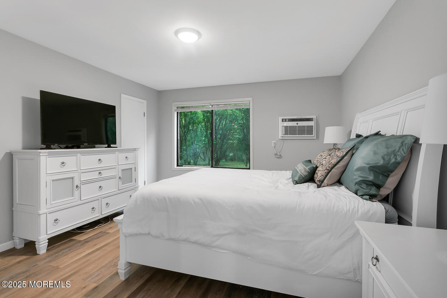 31 Hancock Court Red Bank, NJ 07701 - Photo 15 of 32 a bedroom with a bed and a flat screen tv