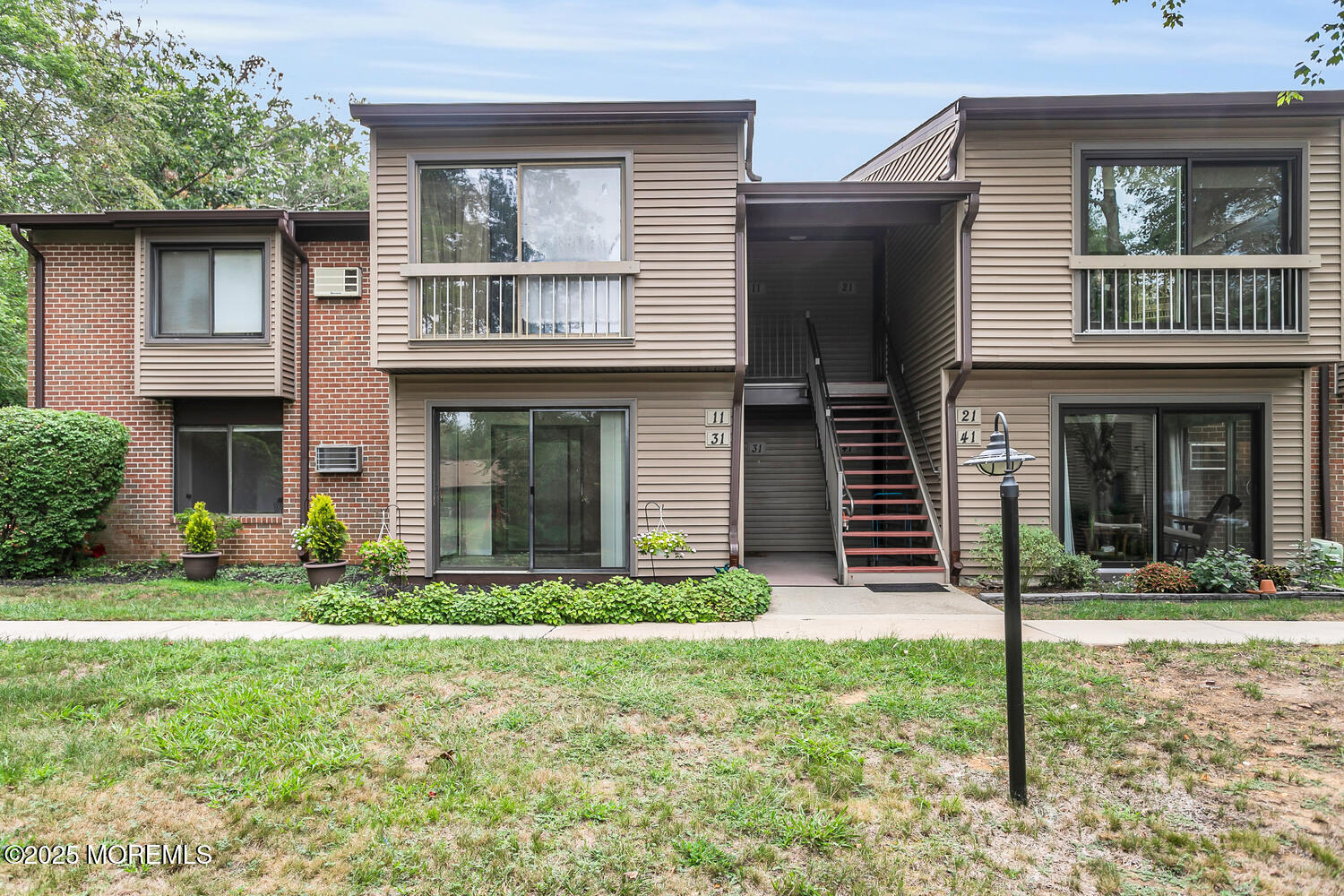 31 Hancock Court Red Bank, NJ 07701 - Photo 21 of 32 a front view of a house with garden