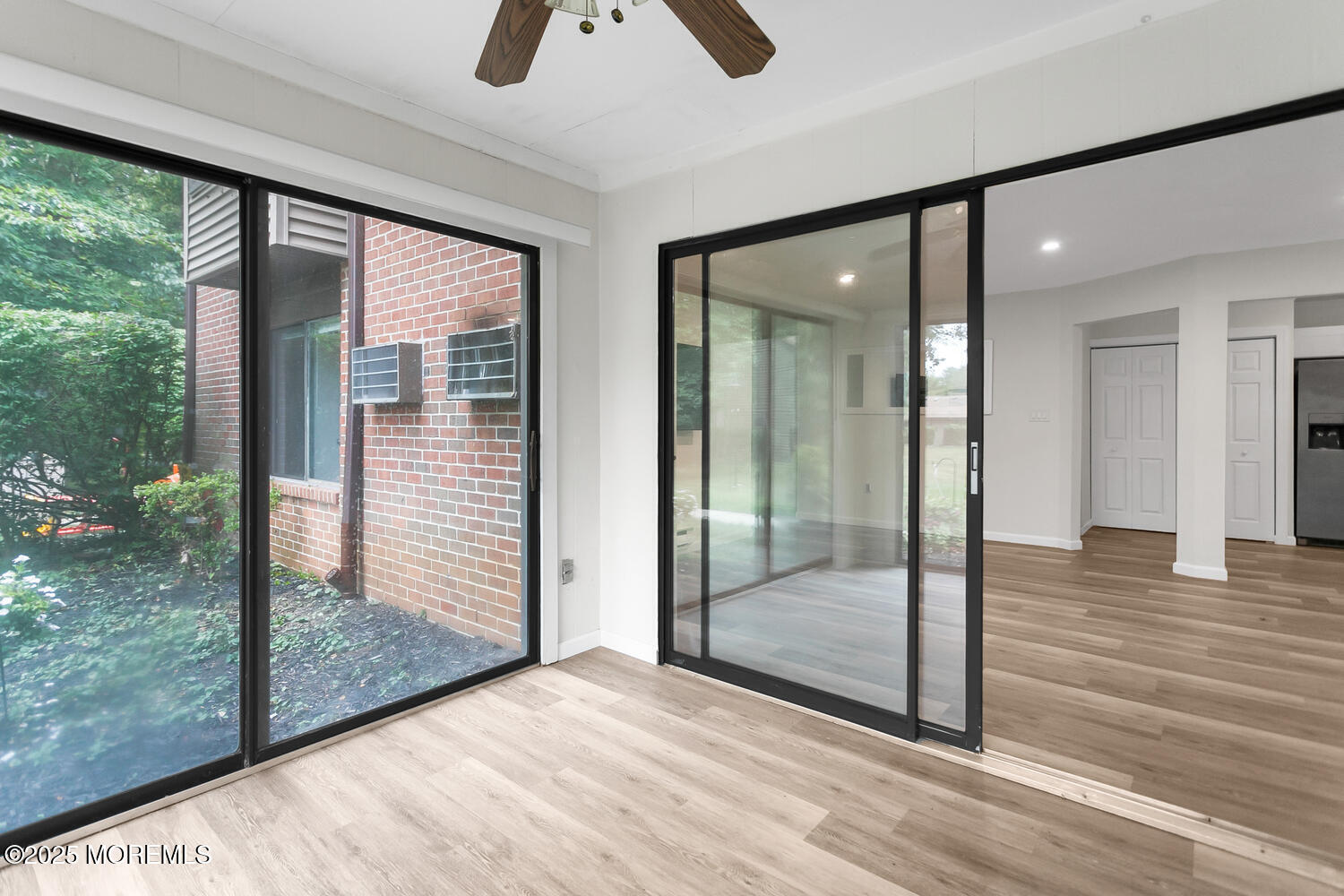 31 Hancock Court Red Bank, NJ 07701 - Photo 5 of 32 a view of a interior space with wooden floor and balcony