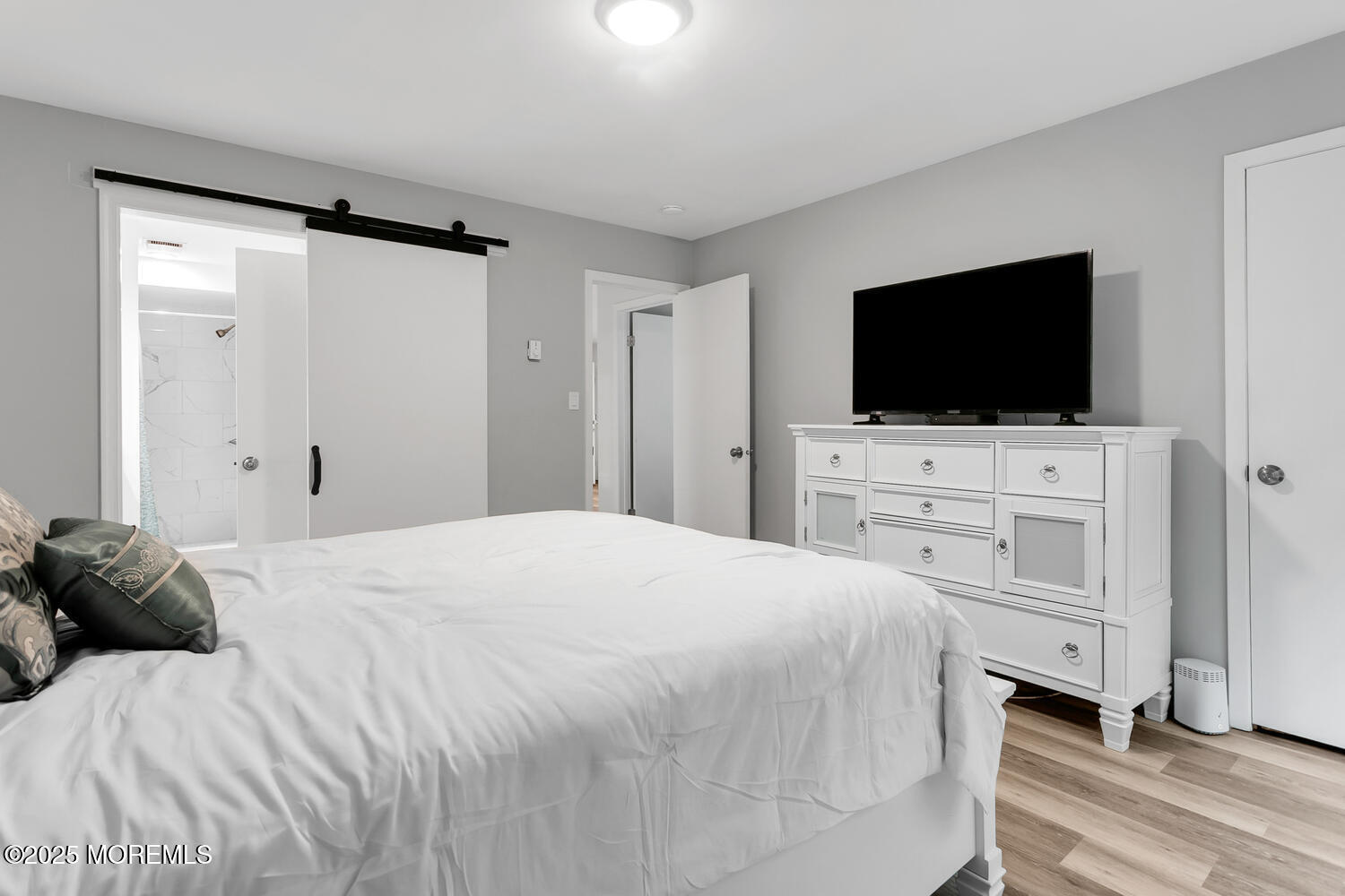 31 Hancock Court Red Bank, NJ 07701 - Photo 10 of 32 a bedroom with a bed tv and a window