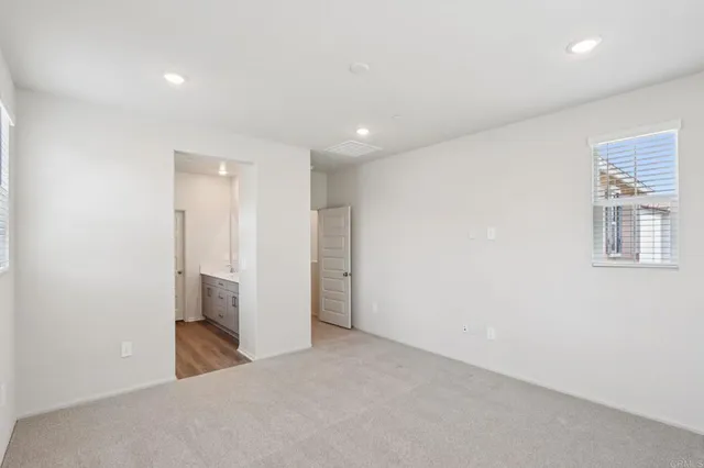 a bathroom with a double vanity sink and mirror