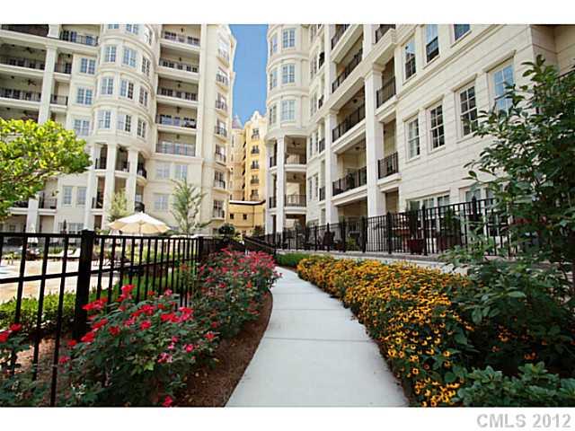 2823 Providence Road, Unit 312 Charlotte, NC 28211 - Photo 16 of 16 a view of a building with a flower garden