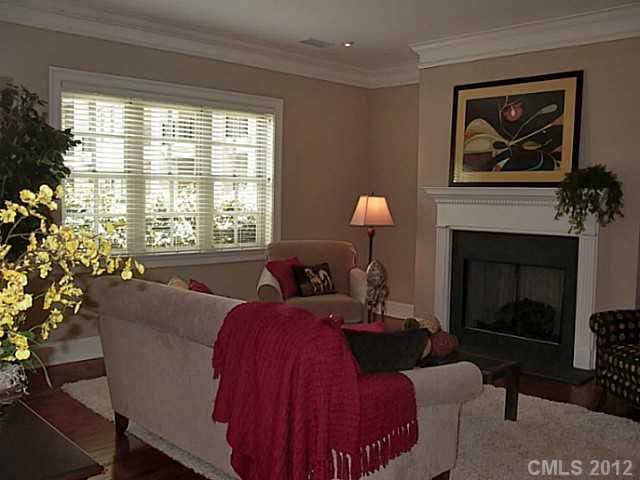 2823 Providence Road, Unit 312 Charlotte, NC 28211 - Photo 7 of 16 a living room with furniture and a fireplace
