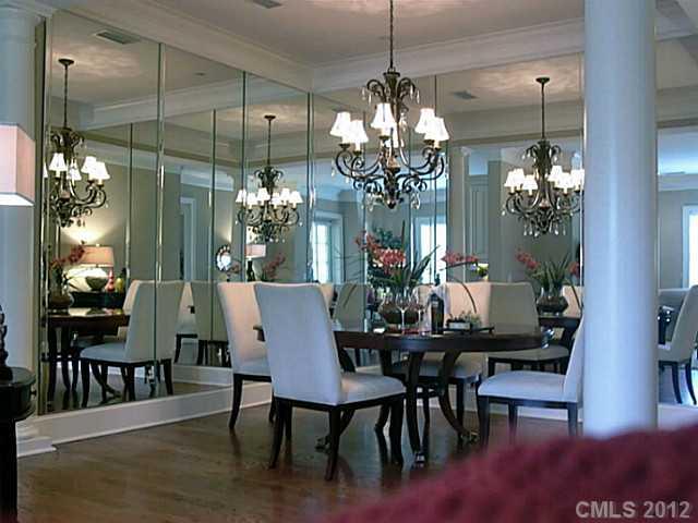 2823 Providence Road, Unit 312 Charlotte, NC 28211 - Photo 8 of 16 a view of a dining room with furniture a chandelier and wooden floor