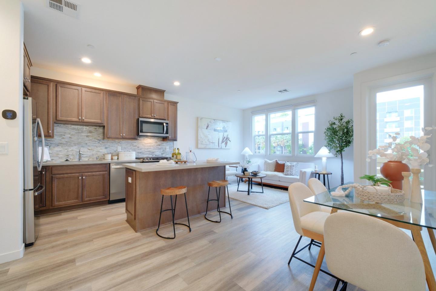 1888 Joshua Tree Circle Milpitas, CA 95035 - Photo 1 of 50 a kitchen with a table chairs refrigerator and cabinets