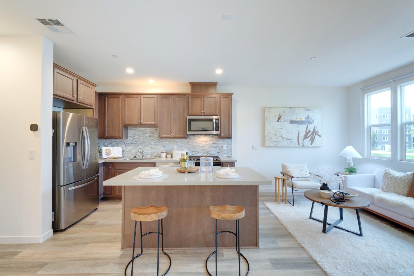 1888 Joshua Tree Circle Milpitas, CA 95035 - Photo 14 of 50 a kitchen with refrigerator cabinets and dining table