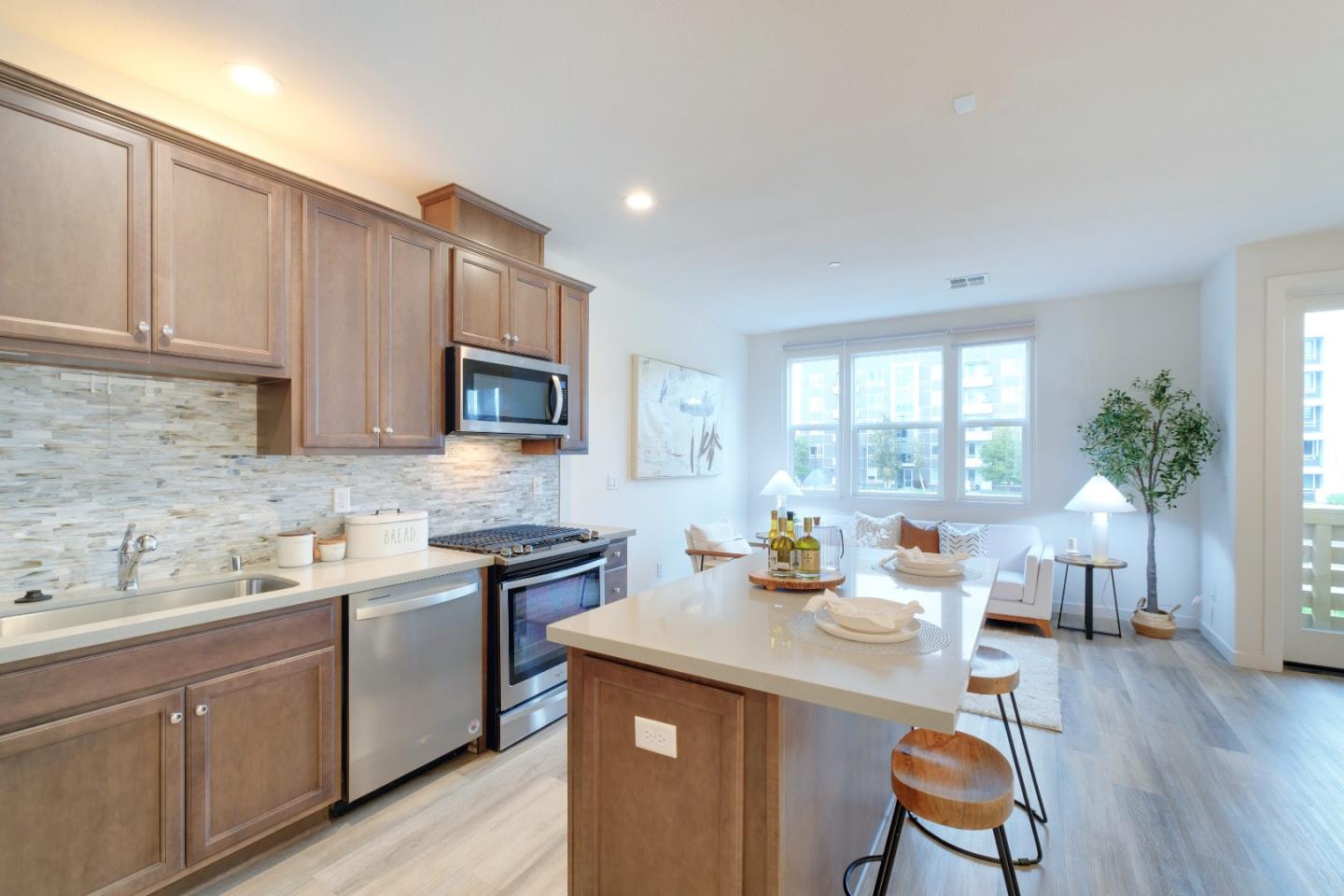 1888 Joshua Tree Circle Milpitas, CA 95035 - Photo 20 of 50 a kitchen with a sink cabinets and wooden floor