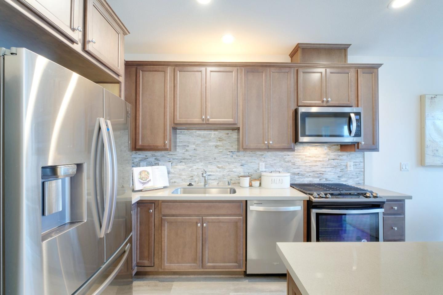 1888 Joshua Tree Circle Milpitas, CA 95035 - Photo 21 of 50 a kitchen with stainless steel appliances a refrigerator stove and sink
