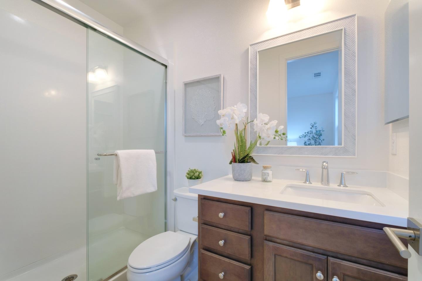1888 Joshua Tree Circle Milpitas, CA 95035 - Photo 28 of 50 a bathroom with a sink a toilet and shower