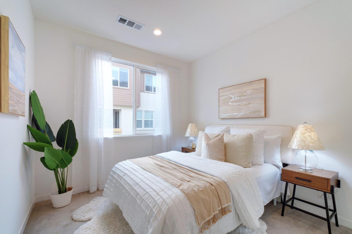 1888 Joshua Tree Circle Milpitas, CA 95035 - Photo 29 of 50 a bedroom with a bed and a potted plant